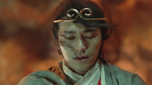 Classic film still: wearing the golden circlet, eyes closed in resolve