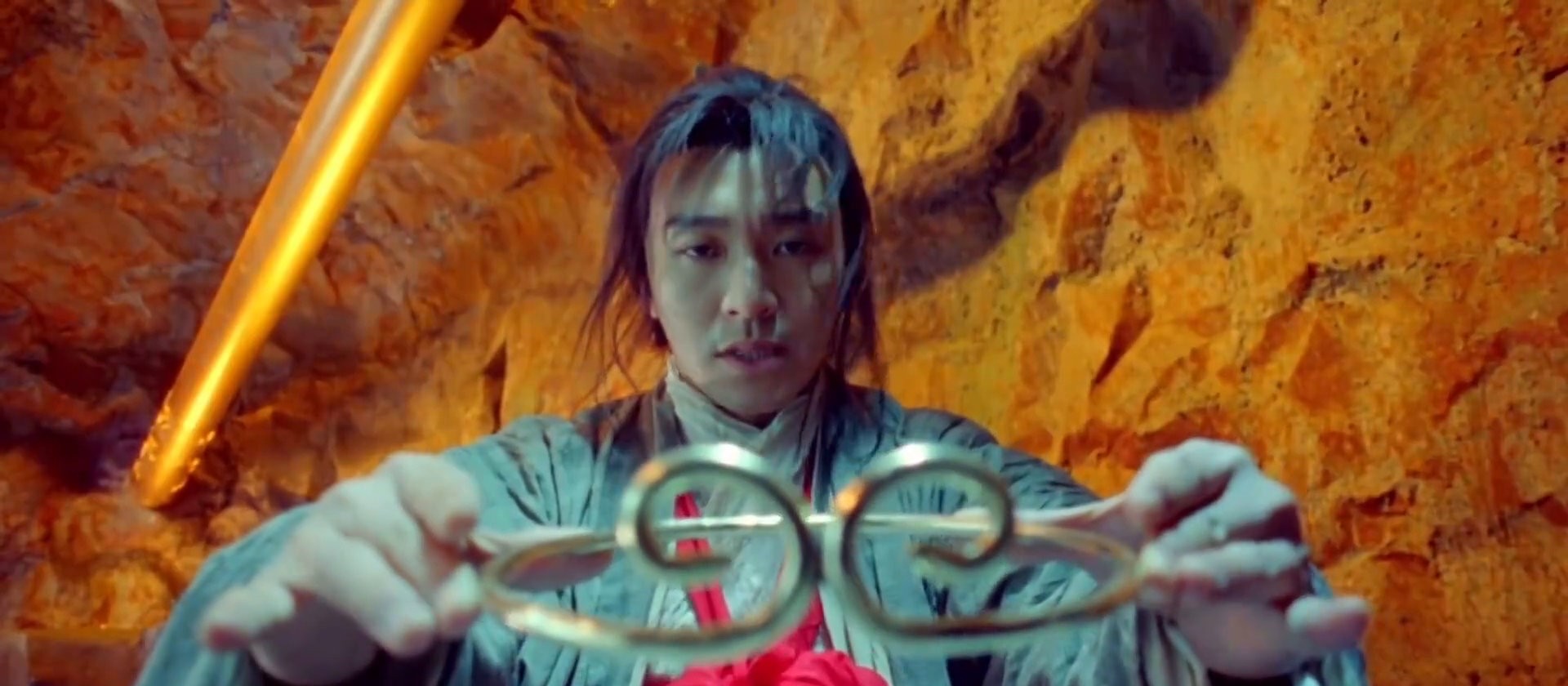 Classic film still: the legendary golden circlet held out in both hands